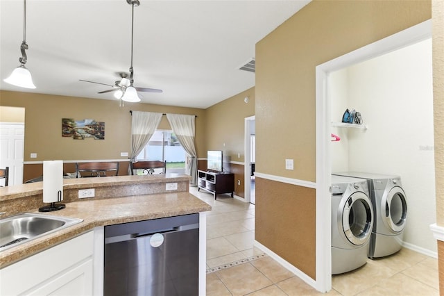 kitchen with light tile patterned floors, dishwasher, pendant lighting, independent washer and dryer, and white cabinets