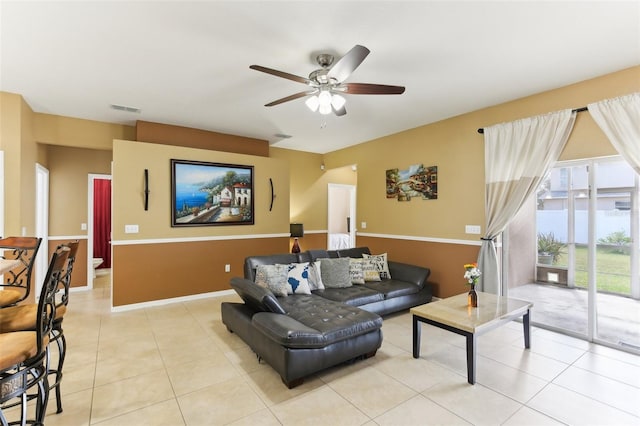 living room with light tile patterned flooring and ceiling fan