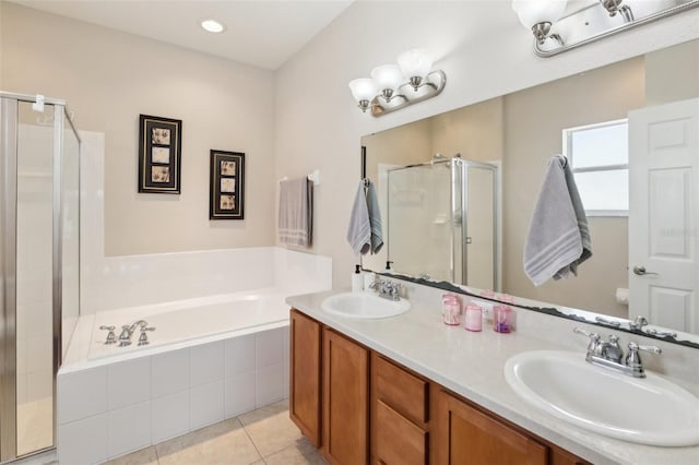 bathroom featuring vanity, shower with separate bathtub, and tile patterned flooring