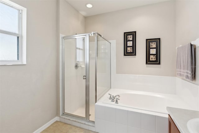 bathroom featuring vanity, separate shower and tub, and tile patterned flooring