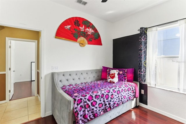 bedroom featuring ceiling fan and hardwood / wood-style floors