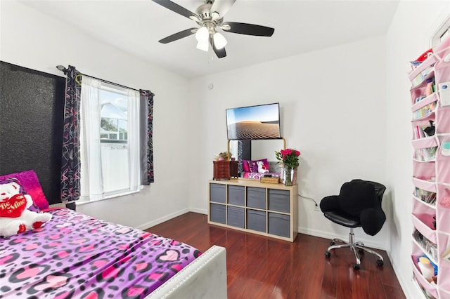 bedroom with ceiling fan and dark hardwood / wood-style floors