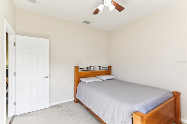 bedroom with light colored carpet and ceiling fan