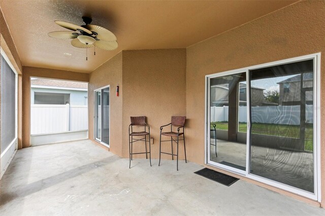 view of patio featuring ceiling fan