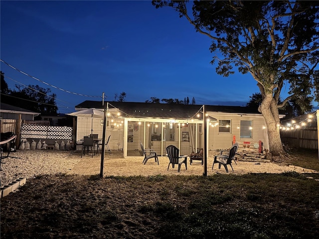 rear view of property featuring a patio