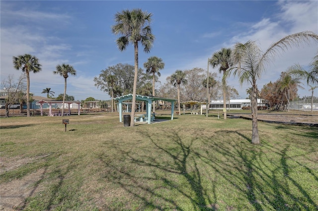 view of home's community with a yard