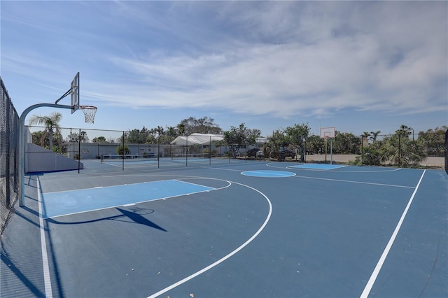 view of sport court featuring tennis court