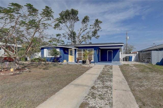 ranch-style home with a carport