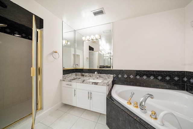 bathroom with tile patterned floors, plus walk in shower, and vanity