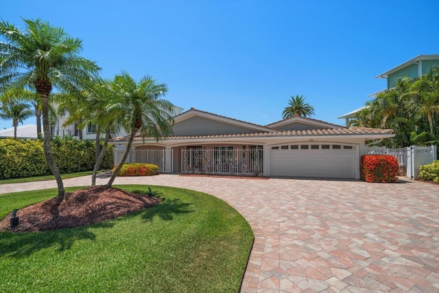 view of front of home with a garage and a front yard