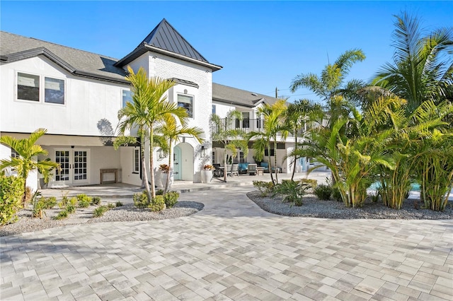 exterior space with french doors and a patio area