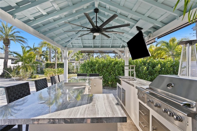 view of patio / terrace with area for grilling, a gazebo, and exterior bar