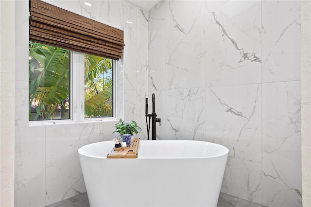 bathroom featuring a washtub