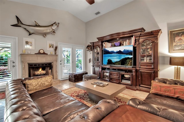 living room with ceiling fan and lofted ceiling