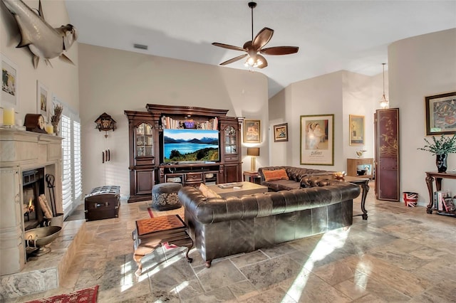 living room featuring high vaulted ceiling and ceiling fan