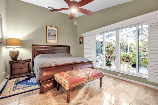 bedroom with multiple windows and ceiling fan