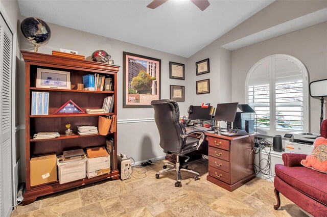 office area with lofted ceiling and ceiling fan