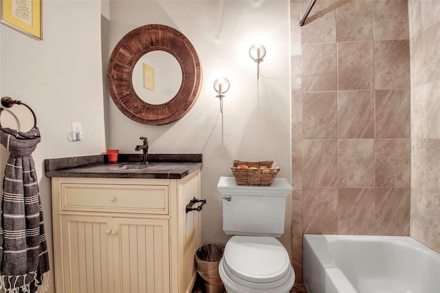 full bathroom featuring vanity, toilet, and tiled shower / bath combo