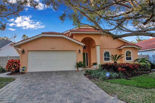 view of front of property with a garage