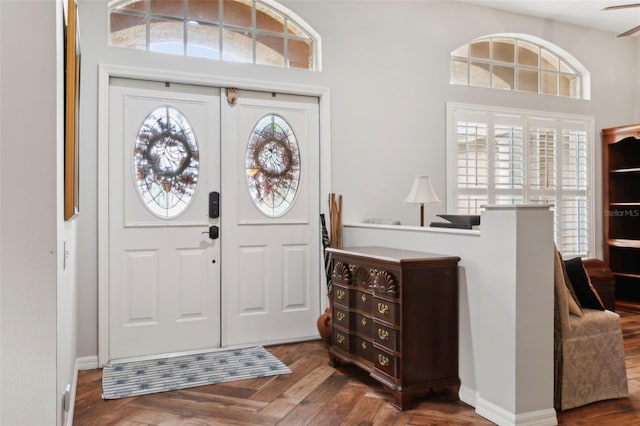 foyer with dark parquet floors