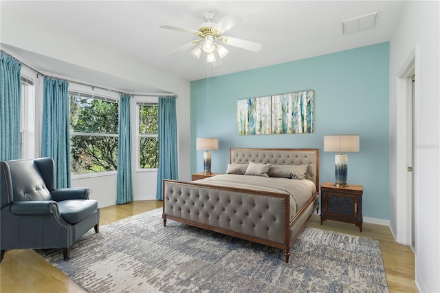 bedroom with hardwood / wood-style floors and ceiling fan