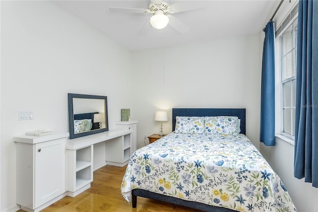 bedroom featuring ceiling fan and light hardwood / wood-style floors