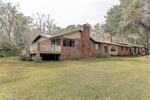 back of house with a deck and a lawn