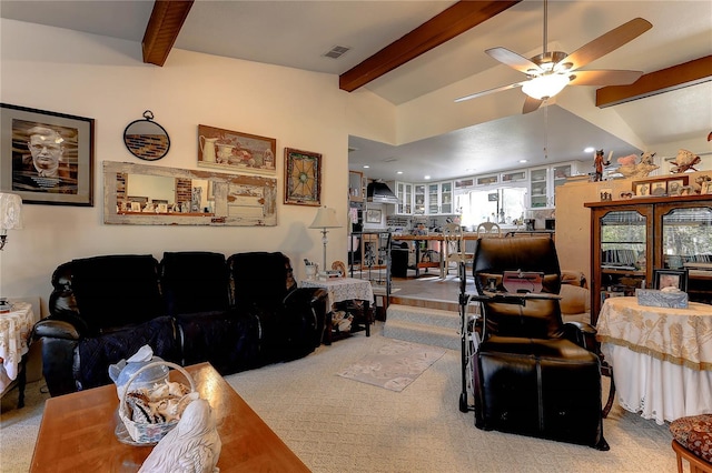 living room featuring ceiling fan, carpet flooring, and vaulted ceiling with beams