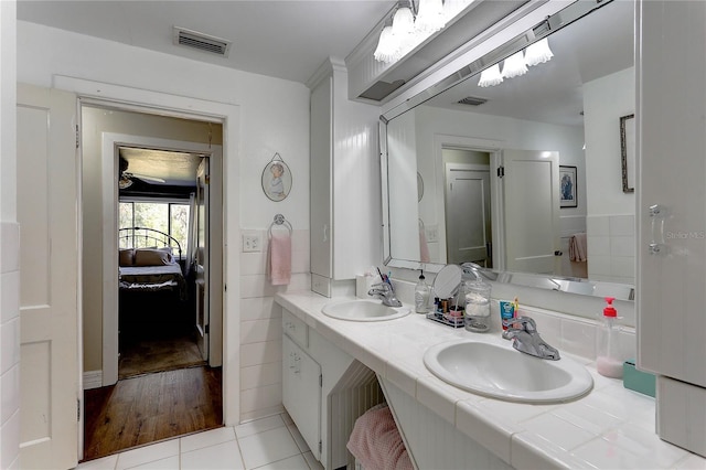 bathroom with vanity and tile patterned floors