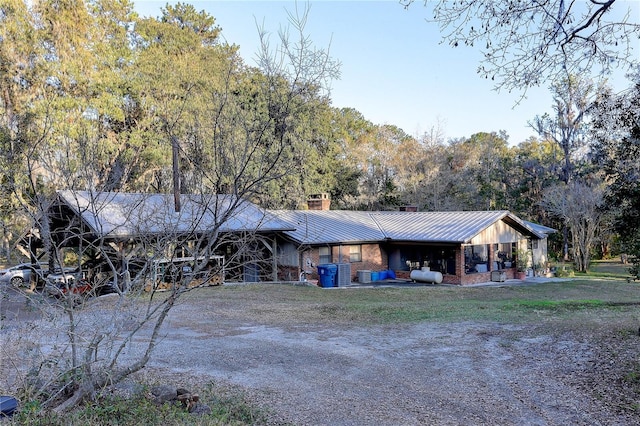 ranch-style house with a front lawn