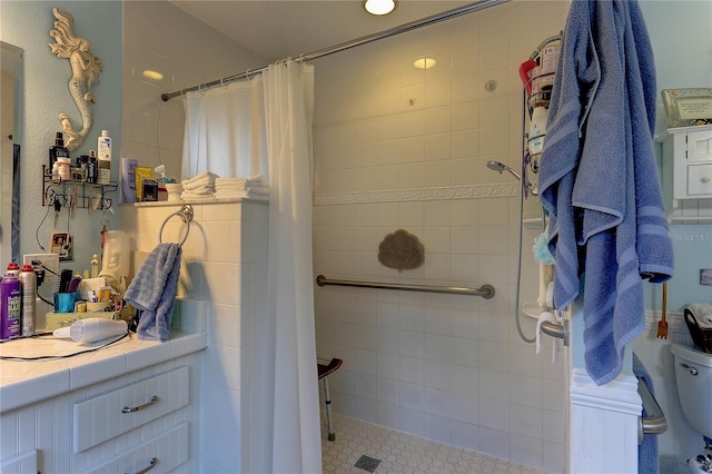 bathroom featuring curtained shower and toilet