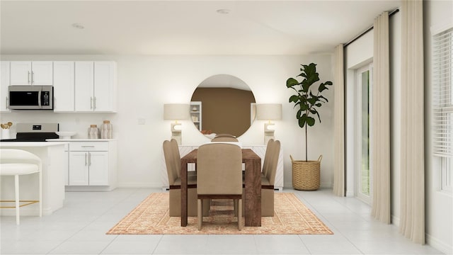 dining area with light tile patterned floors