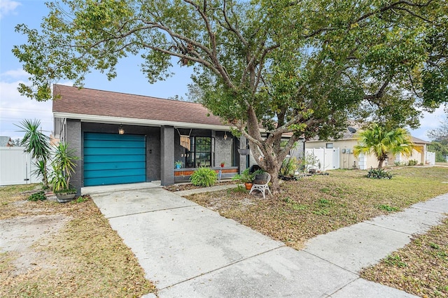 view of front of home with a garage and a front yard