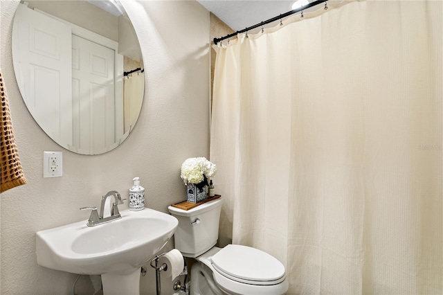 bathroom with toilet and sink