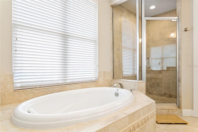 bathroom with tile patterned flooring and plus walk in shower