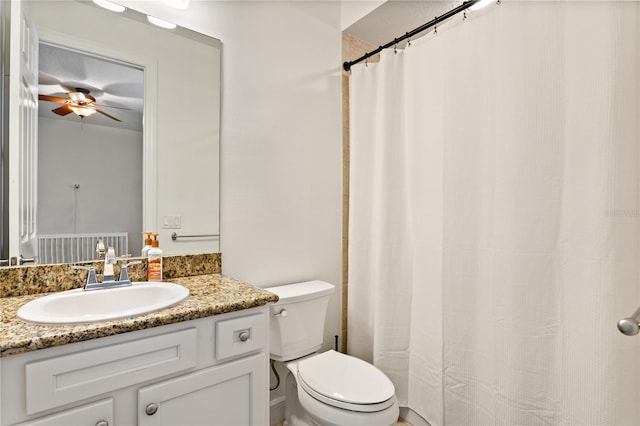 bathroom with vanity, ceiling fan, and toilet