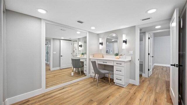 bathroom featuring wood-type flooring and vanity