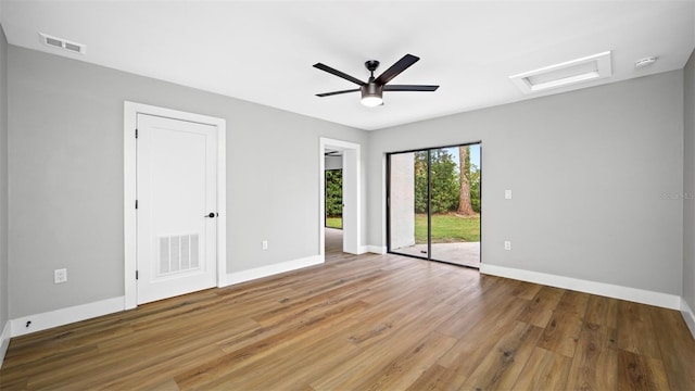 spare room featuring hardwood / wood-style flooring and ceiling fan