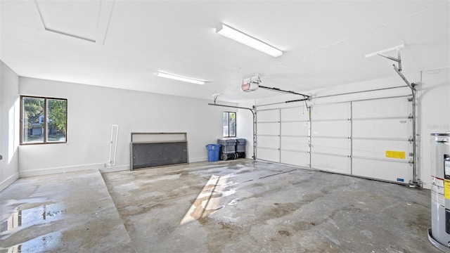 garage with a garage door opener and water heater