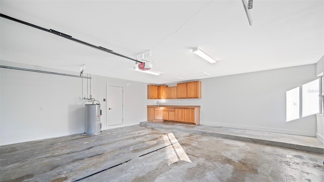 garage with a garage door opener and water heater