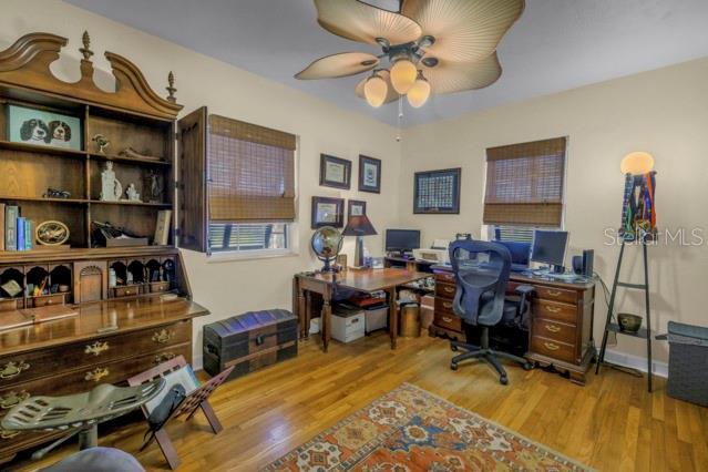 office space featuring ceiling fan and light hardwood / wood-style flooring