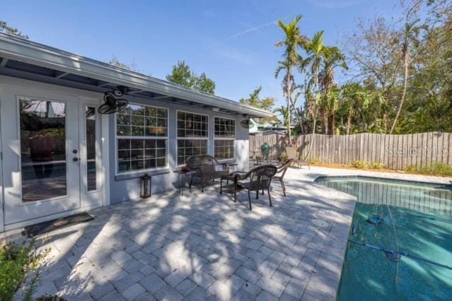 view of patio / terrace featuring a fenced in pool