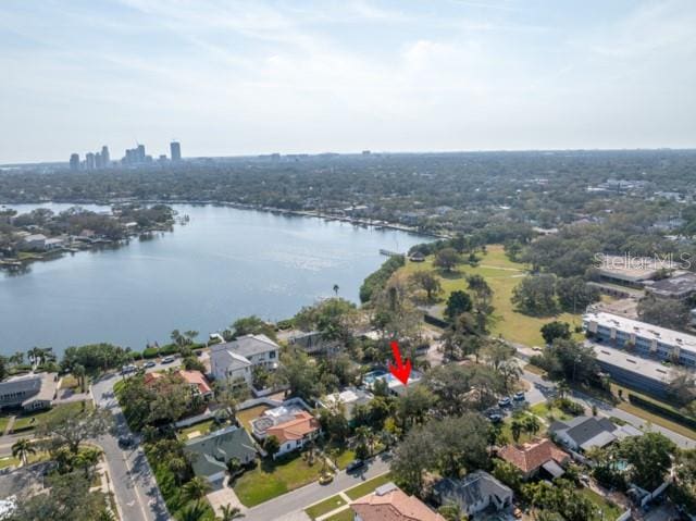 birds eye view of property with a water view