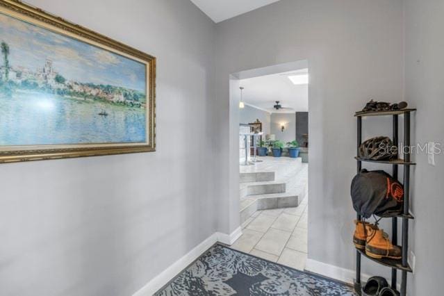 hallway featuring light tile patterned floors