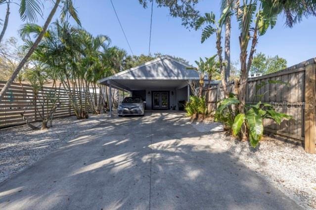 exterior space with a carport