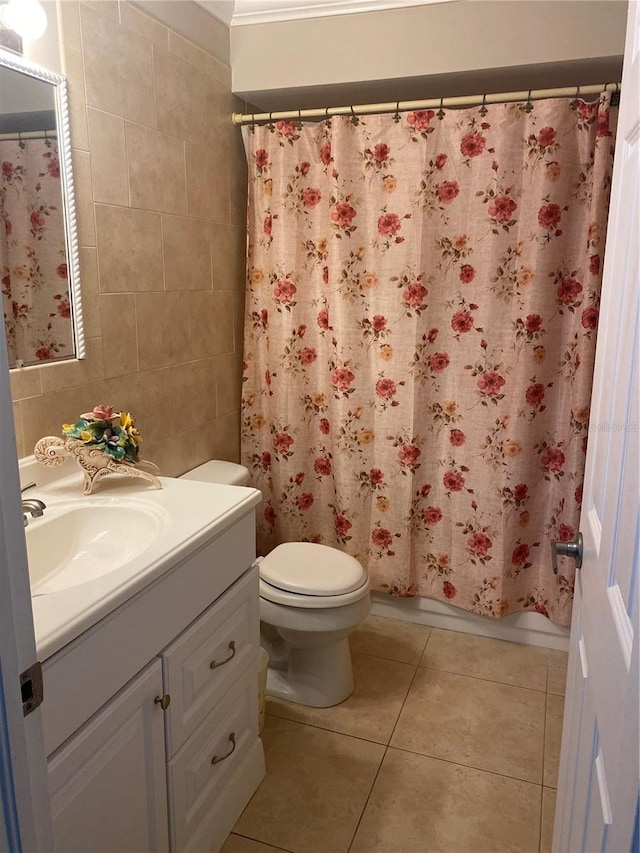 full bathroom with tile walls, vanity, shower / tub combo, toilet, and tile patterned floors