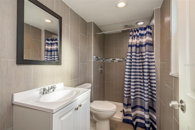 bathroom featuring vanity, toilet, and a shower with shower curtain