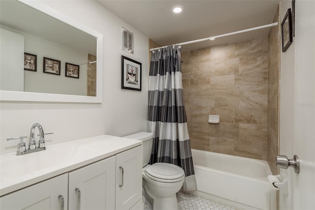 full bathroom with vanity, shower / bathtub combination with curtain, tile patterned floors, and toilet