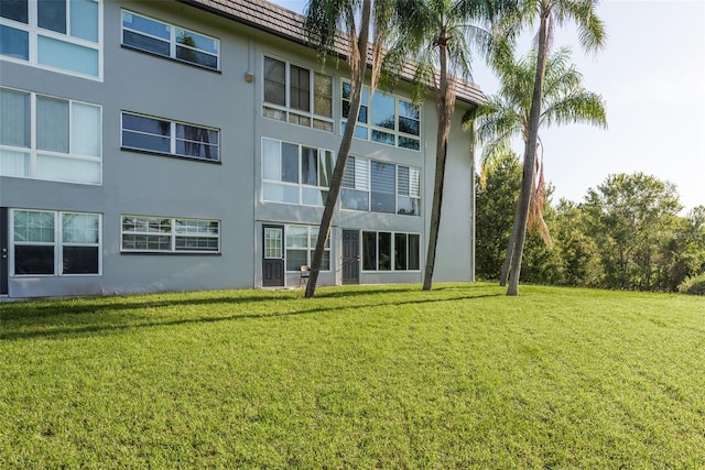 rear view of house with a lawn