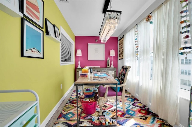 office featuring a chandelier